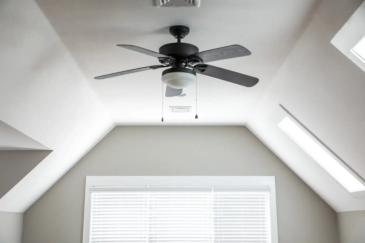 Ceiling fan in white room