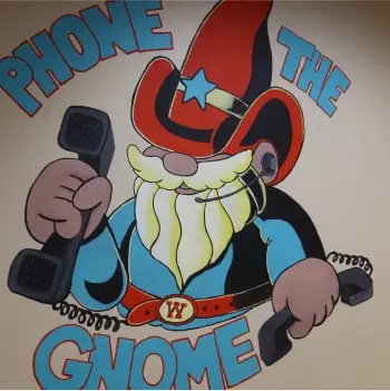 "Phone the Gnome": Willards gnome mascot with two phones.